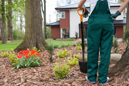 Gardener handing an itemised, free quote to a property owner